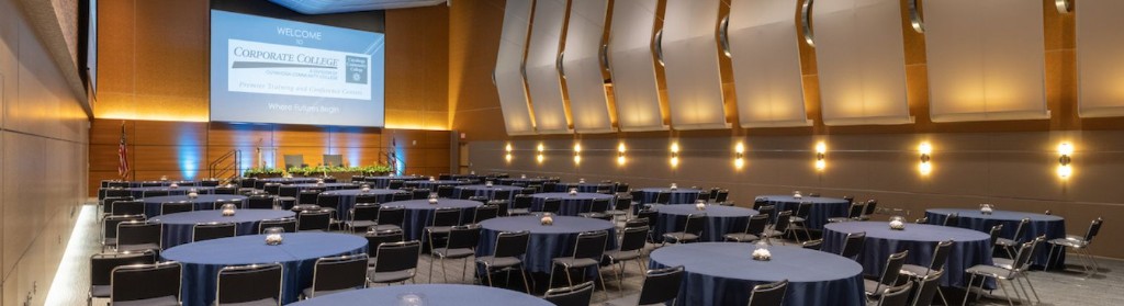 Corporate College East conference room set with round tables